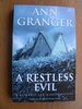 A Restless Evil (Mitchell & Markby 14): An English village murder mystery of intrigue and suspicion