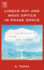Linear Ray and Wave Optics in Phase Space: Bridging Ray and Wave Optics Via the Wigner Phase-Space Picture
