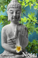 Notes: Beautiful Statue of Buddha in a Garden Setting Holding a Flower
